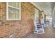 Inviting front porch with comfortable rocking chairs, offering a relaxing outdoor space with a ceiling fan at 4217 Meadowbrook Ct, North Charleston, SC 29420