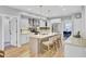 Modern kitchen with island seating, stainless steel appliances, and sleek white cabinetry at 4217 Meadowbrook Ct, North Charleston, SC 29420