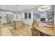 Open-concept living space with kitchen island, dining area, and living room for effortless flow at 4217 Meadowbrook Ct, North Charleston, SC 29420
