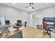 Spacious office featuring hardwood floors and a ceiling fan, offering a functional and stylish workspace at 4217 Meadowbrook Ct, North Charleston, SC 29420