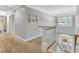 This staircase is in a home with a neutral palette and carpeted floor at 4217 Meadowbrook Ct, North Charleston, SC 29420