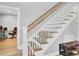 This staircase has white railings and is adjacent to an office space at 4217 Meadowbrook Ct, North Charleston, SC 29420