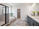 Modern bathroom featuring a glass-enclosed shower, soaking tub, and dual sink vanity at 453 White Magnolia St, Moncks Corner, SC 29461