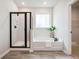 Stylish bathroom featuring a shower, soaking tub, and modern fixtures, offering a spa-like experience at 453 White Magnolia St, Moncks Corner, SC 29461