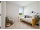 Bright bedroom with natural light, cozy daybed, and comfortable seating area at 453 White Magnolia St, Moncks Corner, SC 29461
