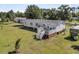 Aerial view of the home featuring a back deck, spacious yard, and mobile food truck at 454 Pooshee Plantation Way, Bonneau, SC 29431