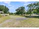 Vast backyard featuring mature trees and open space, great for outdoor activities at 454 Pooshee Plantation Way, Bonneau, SC 29431