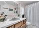 Bathroom with a vanity, mirror, decorative goose figures, and shower with curtain at 454 Pooshee Plantation Way, Bonneau, SC 29431