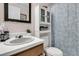 Bathroom featuring a vanity, toilet, and floral shower curtain at 454 Pooshee Plantation Way, Bonneau, SC 29431