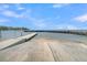 Beach scene showing boat ramp and pier in a sunny setting, ideal for water activities and relaxing by the shore at 454 Pooshee Plantation Way, Bonneau, SC 29431