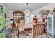 Dining room features hardwood floors, wooden table and chairs, a hutch, and unique lighting at 454 Pooshee Plantation Way, Bonneau, SC 29431