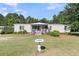 Beautiful home featuring a charming front porch with a white picket fence at 454 Pooshee Plantation Way, Bonneau, SC 29431