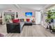 Comfortable living room with plush sectional sofa and a wall-mounted flat screen TV at 454 Pooshee Plantation Way, Bonneau, SC 29431