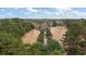 Aerial shot of the home surrounded by trees and a long driveway at 4689 Causey Pond Rd, Awendaw, SC 29429