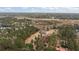 Expansive aerial view of a charming home nestled among lush trees and serene water features at 4689 Causey Pond Rd, Awendaw, SC 29429