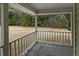 Covered porch overlooking the spacious yard at 4689 Causey Pond Rd, Awendaw, SC 29429