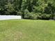 Well-maintained backyard featuring a large grassy area and a privacy fence at 4804 Oak Haven Pl, Summerville, SC 29485