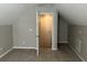 Neutral bedroom showcasing carpeted floor with a door leading to an alcove at 4804 Oak Haven Pl, Summerville, SC 29485