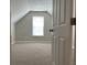 Neutral bedroom showcasing an arched ceiling, carpeted floor, and a window at 4804 Oak Haven Pl, Summerville, SC 29485