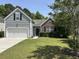 Beautiful two-story home with a well-manicured lawn and mature trees at 4804 Oak Haven Pl, Summerville, SC 29485