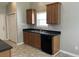Neutral kitchen featuring wood cabinets, black countertops, and stainless steel appliances at 4804 Oak Haven Pl, Summerville, SC 29485