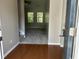 Spacious living room features hardwood and carpet flooring and plenty of natural light at 4804 Oak Haven Pl, Summerville, SC 29485