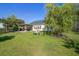 Large backyard featuring a covered patio, playhouse and lush, green grass at 486 Maple Oak Ln, Charleston, SC 29414
