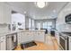 Bright kitchen featuring stainless steel appliances, marble countertops, and white cabinets at 486 Maple Oak Ln, Charleston, SC 29414