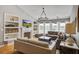Elegant living room featuring built-in shelves, a fireplace, and a comfortable seating area at 486 Maple Oak Ln, Charleston, SC 29414