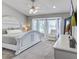 Serene main bedroom featuring a bay window, ceiling fan, television and comfortable bed at 486 Maple Oak Ln, Charleston, SC 29414