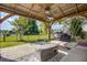 Outdoor living space featuring a covered patio, fireplace and view of the pond at 486 Maple Oak Ln, Charleston, SC 29414