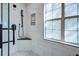 Close-up of shower with marble tile, shower head and shower caddy, and corner seat at 486 Maple Oak Ln, Charleston, SC 29414