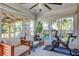Bright sunroom with workout equipment and view of backyard at 486 Maple Oak Ln, Charleston, SC 29414