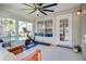 Bright sunroom with ceiling fan, large windows and home gym equipment at 486 Maple Oak Ln, Charleston, SC 29414