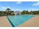 Wide view of a large swimming pool with clear water and building in the background, a perfect spot for relaxation at 486 Maple Oak Ln, Charleston, SC 29414