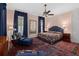 Comfortable bedroom with area rug, ceiling fan, and natural light from the surrounding windows at 5 Logan St, Charleston, SC 29401