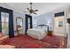 Traditional bedroom with area rug, ceiling fan, a seating area, and en-suite bathroom at 5 Logan St, Charleston, SC 29401