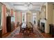 Formal dining room with a long table, chandelier, fireplace and elegant decor at 5 Logan St, Charleston, SC 29401
