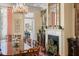 Elegant dining room features a fireplace, a grand chandelier and view to the kitchen at 5 Logan St, Charleston, SC 29401