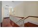 Long hallway featuring wood floors and stairs showcasing the home's spacious layout and design at 5 Logan St, Charleston, SC 29401