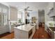 Spacious, well-lit kitchen with an island, stainless steel appliances, and traditional white cabinetry at 5 Logan St, Charleston, SC 29401