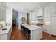 Spacious kitchen with white cabinetry, stainless steel appliances, and a large center island at 5 Logan St, Charleston, SC 29401