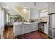 Stylish kitchen featuring stainless steel appliances and seamless flow to living area at 5 Logan St, Charleston, SC 29401