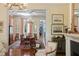 Living room featuring a fireplace, elegant decor, and an adjacent formal dining area at 5 Logan St, Charleston, SC 29401