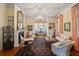 Bright, inviting living room with plush seating, a fireplace, and traditional decor at 5 Logan St, Charleston, SC 29401