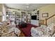 Inviting living room with built-in bookshelves, comfortable seating, and bright lighting at 5 Logan St, Charleston, SC 29401