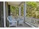 Inviting porch with wicker seating, perfect for relaxing and enjoying the outdoors at 5 Logan St, Charleston, SC 29401