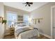 This is a quaint bedroom with hardwood floors, neutral colored walls, and a ceiling fan at 504 Marsh Cove Cir, Summerville, SC 29486