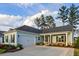 Charming home with a two-car garage, manicured landscaping, and stone-accented porch at 504 Marsh Cove Cir, Summerville, SC 29486