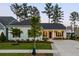 Beautiful single-story home with manicured front yard and charming covered porch at 504 Marsh Cove Cir, Summerville, SC 29486